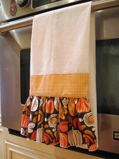 a kitchen towel hanging on the side of an oven