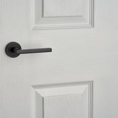 an open door with a black handle on it