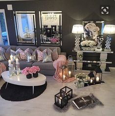 a living room filled with lots of furniture and decor