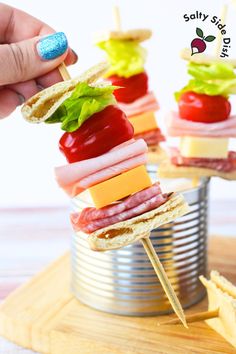 mini sandwiches with meat, cheese and vegetables in a can