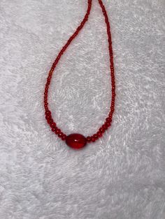 Cherry red glass beaded necklace. Red Single Strand Beaded Bracelet, Handmade Red Beaded Choker Necklace, Adjustable Red Necklace With Colorful Beads, Red Oval Beads Jewelry, Red Oval Beaded Necklace, Red Single Strand Crystal Necklace With Round Beads, Red Choker Necklace With Colorful Beads, Red Crystal Necklace With Single Strand Round Beads, Red Round Bead Necklaces For Party