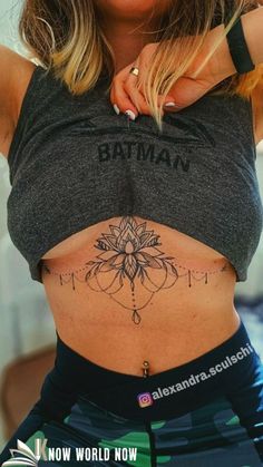 a woman with a tattoo on her stomach