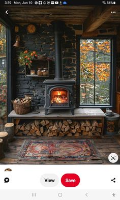 an image of a fire place in the middle of a room with logs on it