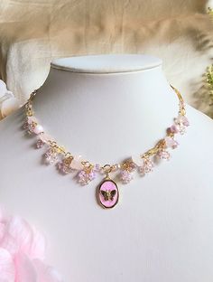 The butterfly is associated with change and metamorphosis, and holds a special place in the hearts of romantics as a symbol of beauty and transformation. This necklace features a dainty butterfly pendant, and to match, soft colours are used to give it an ethereal quality. 🌸Handcrafted with rose quartz chips, crystal beads, glass seed beads, gold-plated brass, stainless steel findings and tarnish resistant copper wire. 🌸All variations come with a 5cm extender. Pink Butterfly Charm Necklace For Gift, Pink Butterfly Necklace For Gift, Pink Butterfly Necklace Gift, Dainty Pink Butterfly Necklace As A Gift, Dainty Pink Butterfly Necklace For Gift, Dainty Pink Butterfly Necklace As Gift, Pink Butterfly Dainty Necklace, Pink Pendant Necklace With Butterfly Charm, Pink Butterfly Charm Pendant Necklace