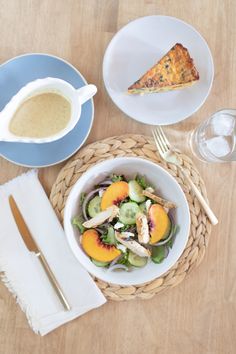 a table topped with plates and bowls filled with food