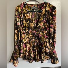 Very Beautiful Blouse In Size Xs From Anthropologie. Buttons Down The Front To A Deep V Neck. Sleeves Are Buttoned As Well To A Bell Shape At The Ends. The Third Button From The Bottom Has No Loop But You Can’t Tell When It’s Buttoned. Comes With Extra Button, Tried On But Never Worn. Black, Pink, And Gold Floral Pattern. Floral Print Long Sleeve Top For Night Out, Long Sleeve Floral Print Tops For Night Out, Chic Floral Print Tops For Night Out, Bohemian V-neck Top For Night Out, Floral Print V-neck Blouse For Night Out, V-neck Floral Print Blouse For Night Out, Party Floral Print V-neck Blouse, Floral Print Blouse For Night Out In Fall, Casual Floral Print Blouse For Night Out