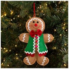 an ornament shaped like a gingerbread man hanging from a christmas tree