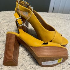 Yellow Leather Gb Sandals. Have A Couple Blemishes But Still New With Tags And Attached To Each Other. Size 9. Yellow Platform Sandals With Block Heel, Yellow High Heel Sandals With Stacked Heel, Yellow Sandals With Stacked High Heel, Chic Yellow Open Toe Wedge Sandals, Chic Yellow Leather Wedge Sandals, Chic Yellow High Heel Wedge Sandals, Yellow Block Heels With Buckle Closure, High Heel Suede Sandals For Vacation, Yellow Sandals With Wrapped Heel And Round Toe