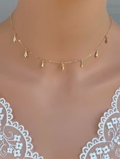 Dainty little 14K gold filled necklace with Long Tiny Diamond Drop Charm Perfect looking on its own or layering with other dainty necklaces as pic #5 , 6. 100%14k Gold Fill in all components. It makes of.. -14/20 Gold-Filled 3.4x8.4mm Long Tiny Diamond Drop Charm -14k Gold Fill chain (not gold plated) with spring claw. -Come up with beautiful ribbon gift box and -One set of Care instruction package . MORE LAYERED NECKLACE~ https://www.etsy.com/shop/rainbowearring1?section_id=17891444&ref=sho Diamond Drop Necklace, Bridesmaids Gift Sets, Dainty Necklaces, Bride Necklace, Wedding Bride Jewelry, Ribbon Gift, Spike Necklace, Dangle Necklaces, Tiny Diamond