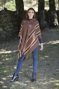 Hooded rustic poncho with brown and white stripes. Handmade in alpaca and lamb wool, this poncho will keep you warm in cold winter days.Overview: Material: Wool Blend. Color: Brown. Crewneck Hooded Size:Length: 90 cm (35.43")Width: 110 cm (43.30")It refers to the total measurements of the poncho when it is fully open (like a blanket)Note: Since this garment is hand-crafted, there might be some variations in color and details of descriptions. Cowboy With Poncho, Western Poncho Women, Cuban Hat, Casual Brown One-size Poncho, Brown Poncho For Layering, One Size, Poncho Mexican, Brown Alpaca Cape Poncho, Panama Hat Men, Poncho Pullover