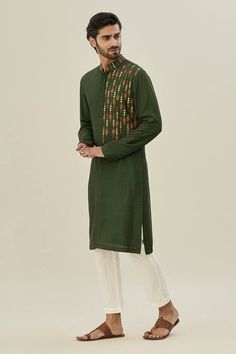 Olive green placement embroidered kurta. Paired with a pant. - Aza Fashions Green Cotton Sherwani With Zari Work, Green Cotton Kurta With Embroidered Border, Green Embroidered Sherwani For Festivals, Designer Green Cotton Sherwani, Festive Green Sherwani With Embroidered Border, Green Long Sleeve Traditional Wear With Embroidered Border, Cotton Green Sherwani, Eid Green Sherwani With Floral Embroidery, Green Sherwani With Floral Embroidery