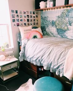 a bedroom with a map on the wall