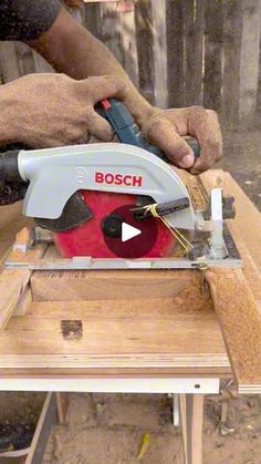 a man using a circular saw to cut wood with a cordless jig tool