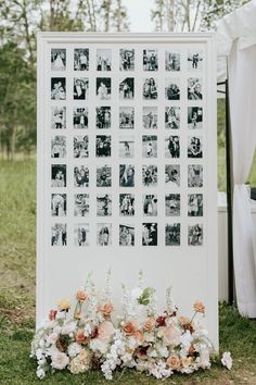 an outdoor ceremony with flowers and pictures on the wall