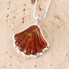 This is a wonderful pendant, ideal if you are looking for something a little different. This pendant is set with genuine carved amber. The large piece of amber measures 21 x 26 mm (including bale). and comes with a lovely 18 inch chain.See my shop for matching earrings and other amber items:https://www.etsy.com/uk/shop/gotcharm Baltic Amber Pendant Necklace, Amber Pendant Necklace In Baltic Amber, Amber Hallmarked Necklaces For Gifts, Baltic Amber Necklace With Round Pendant, Round Baltic Amber Pendant Necklace, Orange Baltic Amber Pendant Necklace, Round Pendant Baltic Amber Necklace, Baltic Amber Pendant Necklace As Gift, Amber Pendant Necklace With Lobster Clasp