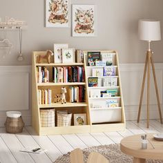 a living room filled with furniture and bookshelves