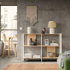 a living room filled with furniture next to a wall mounted art piece on top of a wooden shelf