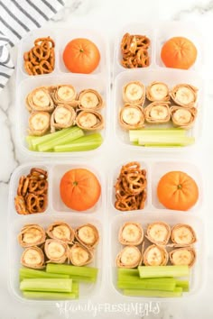 four plastic containers filled with food on top of a white marble countertop next to an orange and celery