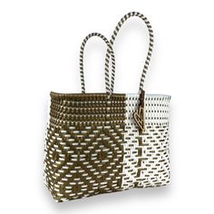 Indulge in luxury with our Duo tote, featuring the timeless Maria Victoria Bag in a captivating handwoven design. Made from repurposed plastic, this versatile bag is perfect for poolside lounging, beach outings, grocery excursions, and everyday tasks. With easy cleaning and fade-resistant colors, you'll never want to leave without it. Measurements: length x depth x height with handle length Extra Large(OT): 17.5x8x18.5 inches with 8 inch handles Large(OR): 15.5x7.5x15 with 8 inch handles Medium( Luxury Tote Beach Bag With Handles, White Woven Square Straw Bag, White Open Weave Straw Bag For Everyday Use, Modern White Bags For The Beach, Modern White Bags For Beach, Modern White Beach Bag, White Woven Leather Straw Bag For Beach, White Recyclable Beach Bag For Shopping, White Woven Square Beach Bag