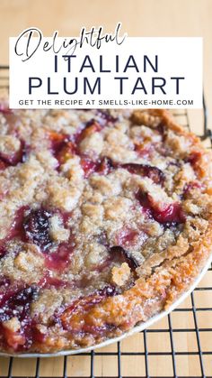 a close up of a pie on a rack with the words delightful italian plum tart