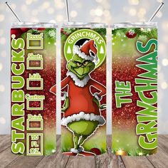 two christmas soda cans with the grinchmas logo on one side and santa clause on the other