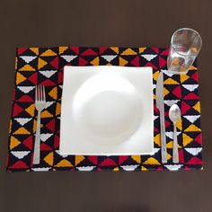 a white plate with a fork and knife on top of it next to a napkin