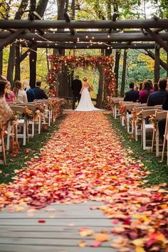 A beautiful fall garden wedding ceremony with an aisle covered in autumn leaves, surrounded by simple yet charming decor and lights, perfect for a fall wedding. Garden Wedding Decor Ideas, Wedding Planning Board, Wedding Decor Ideas, Rustic Fall Wedding