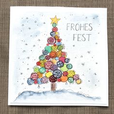 a christmas tree made out of buttons on top of a piece of paper with the words frohes fest