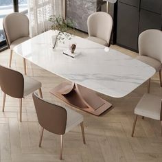 a marble dining table surrounded by beige chairs