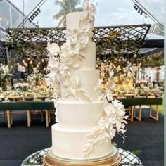 a wedding cake with white flowers on it