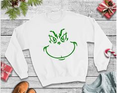 Kids Christmas Sweatshirt or Shirt Rabbit Skins or Gildan Fleece Sweatshirt or Shirt(Dependent on inventory availability, may be a different brand) Sweatshirt color options are white, gray, red or black Shirt color options are white, gray, red or black Please indicate in the notes to seller section as checkout what color vinyl you would like the face in. Options are: green, red, black or white If you have a different color in mind please send me a message to check availability If you would like Christmas Shirts Vinyl, Atlanta Braves Shirt, Kids Christmas Shirt, Toddler Christmas Shirt, Boys Christmas Shirt, Braves Shirts, Christmas Shirts For Kids, Birthday Boy Shirts, Toddler Christmas