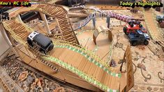 there is a toy train set in the middle of this play area that looks like it's made out of cardboard