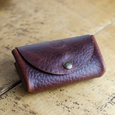 Handmade Leather Coin Purse and Card Wallet Thanks to the ease of this purse you can carry coins, notes and cards. Designed for daily Use it's practical and durable.  Made to last and stand the test of time, in the luxurious, hardwearing Horween Chromexcel Bison Leather. This Leather Pouch has 2 compartments with antique brass press studs. Approx Dimensions: Width: 70cm Height: 8cm Depth: 3cm closed Horween Chromexcel® is the original pull-up which is now almost a centenarian. It is produced to Brown Wallet With Cell Phone Pocket As Gift, Vintage Wallet With Interior Key Chain Holder, Pouch Wallet With Coin Pocket As Gift, Leather Coin Purse With Cell Phone Pocket As Gift, Bifold Coin Purse With Cell Phone Pocket As Gift, Brown Coin Purse With Card Slots, Horween Chromexcel, Handmade Leather Purse, Small Leather Purse