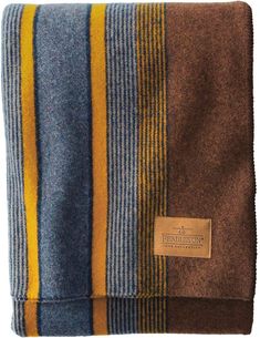 Made-in-America wool camp throw that's one of our most popular. Camp blankets were originally used by shepherds to brave the elements of the Pacific Northwest right where our rugged wool versions are still woven today. These smaller sized blankets make a great gift for outdoor enthusiasts. Stripes run vertically. 54" x 66" Pure virgin wool/cotton Fabric woven in our American mills Dry clean Made in the USA " Pendelton Blankets Pendleton Woolen Mills, Wool Blanket Men, Pendleton Yakima Camp Blanket, Pendleton Yellowstone Blanket, Darning Wool Blanket, Man Blankets, Park Blanket, Pendleton Blanket, Badlands National Park