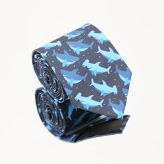 a blue and black tie with sharks on it