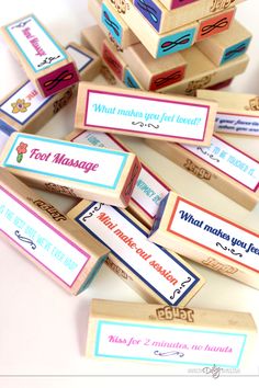 several small wooden boxes with different types of labels on them, all stacked up together