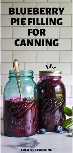 two mason jars filled with blueberry pie filling for canning