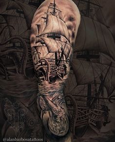 an arm with a ship and octopus on it