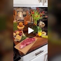 a kitchen counter topped with meat and vegetables