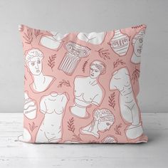 a pink and white pillow with different images on it