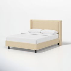 a bed with white sheets and pillows on top of it's headboard is shown in front of a plain background