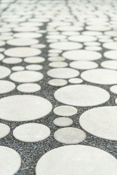 a black and white tiled floor with circles on it