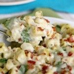 a bowl filled with macaroni salad on top of a table