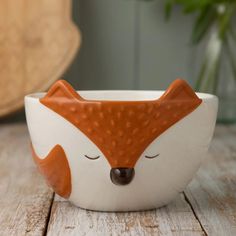 off-white and orange bowl with fox design set on a wooden table. Table Top Accessories, Ceramic Table Top, Fox Mug, Ceramic Storage, Top Accessories, Woodland Fox, Arm Chair Table, Fox Ears, Fox Design