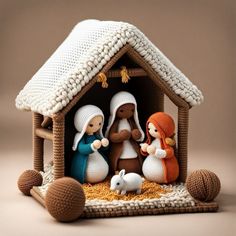 a crocheted nativity scene with three people and a baby in the manger