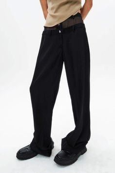 Loose-fit straight-leg trouser. Invisible button and zipper closure to the front. Double-waist design. See-through at waist. Two side-pockets. Model is 178cm (5'10), Wearing Size M. Body Color - Black Button color - Silver Body Fabric - 98% natural silk, 2% elastane. Solid Straight Dress Pants With Button Closure, Solid Color Straight Dress Pants With Button Closure, Straight Dress Pants With Button Closure, Casual Wide Leg Pants With Straight Hem For Office, Casual Full-length Bottoms With Pressed Crease, Baggy Straight Leg Dress Pants, Baggy Full-length Pants With Button Closure, Baggy Full-length Bottoms For Workwear, Baggy Pants With Button Closure