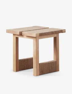 a small wooden table with two legs and a square seat on the bottom, made out of natural wood