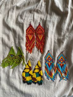 4 unique pairs of colourful beaded dangly earrings. I only have one of each so message which one you like when bought ❤️ Can be worn as spiritual protection, in ceremony or every day.  Made by loving indigenous hands in the heart of Mayan Guatemala. Traditional Colorful Festival Earrings, Handmade Teardrop Beaded Festival Earrings, Handmade Teardrop Beaded Earrings For Festivals, Traditional Colorful Beaded Earrings For Festival, Handmade Spiritual Beaded Dangle Earrings, Handmade Colorful Beaded Drop Earrings, Unique Beaded Earrings With Tiny Beads For Festivals, Handmade Colorful Festival Earrings, Handmade Colorful Earrings For Festival