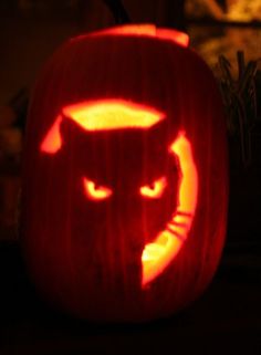 a pumpkin carved to look like a cat