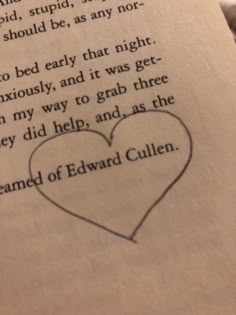 an open book with a drawing of a heart on it's page and the words edward cullinn written in black ink